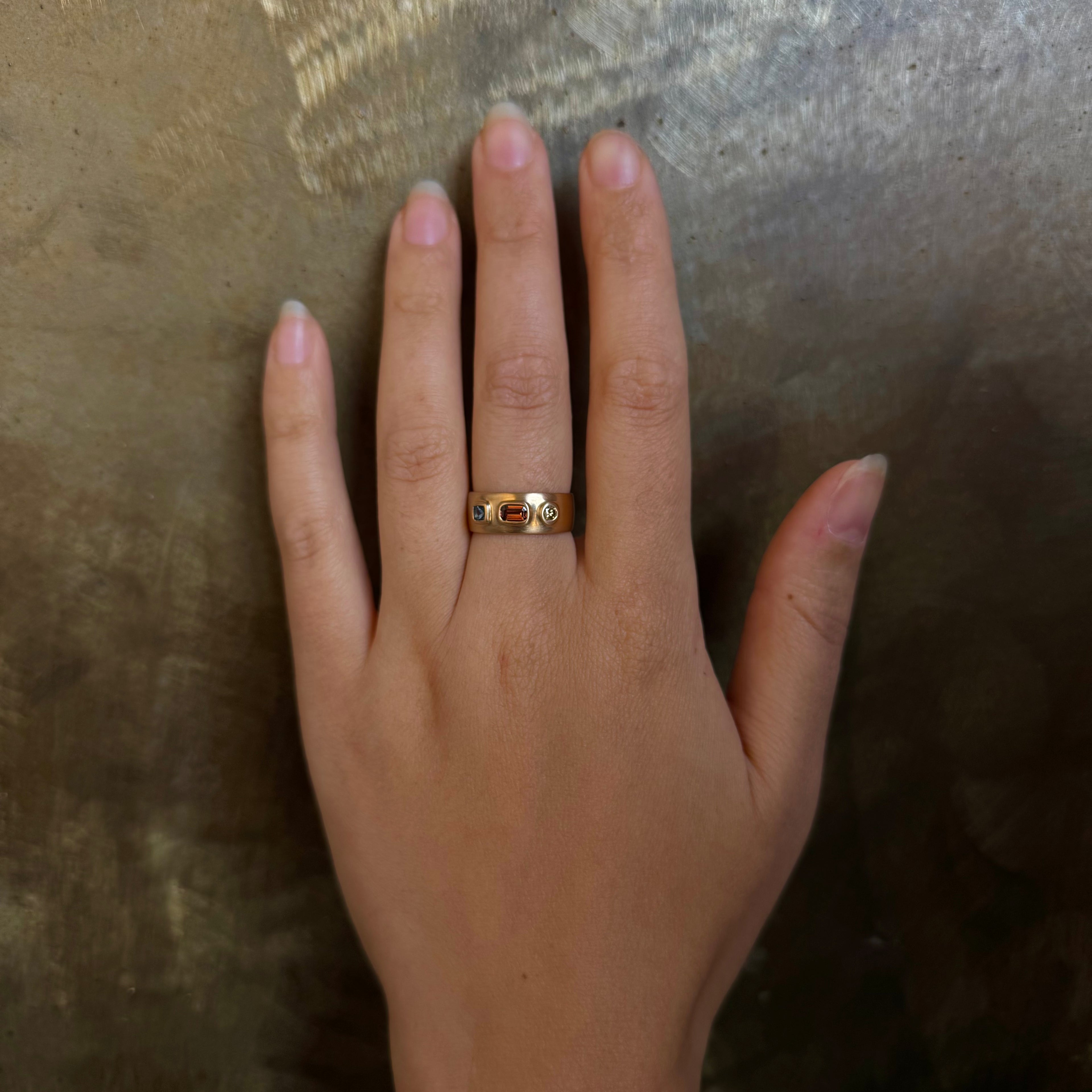 Handmade 14k gold cigar band ring with natural blue/red sapphires and brown diamond by em jono