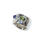 Handmade sterling silver cigar band with lapis carved face and peridot by em jono