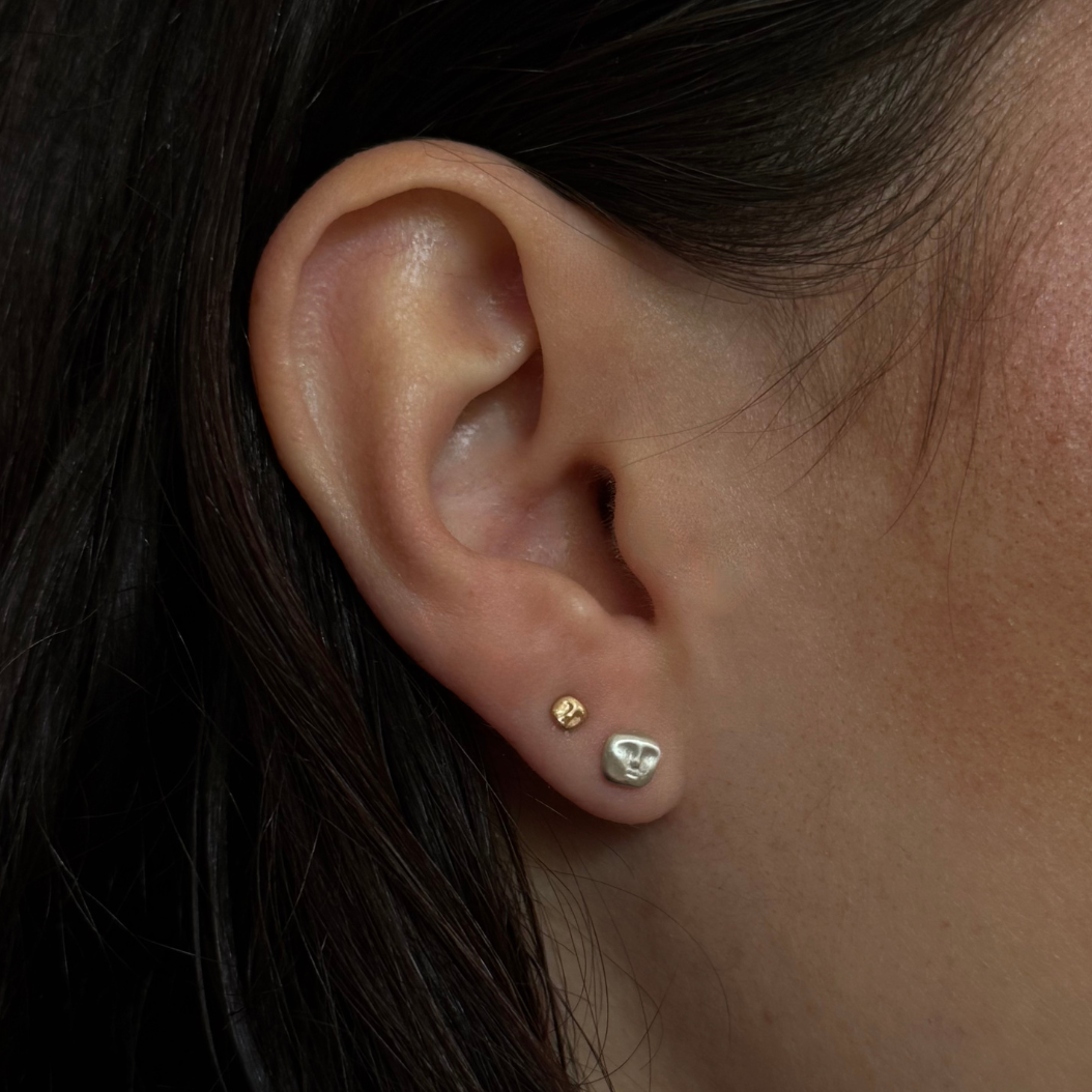 gold and silver face stud earrings by em jono