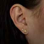 gold face stud earrings by em jono