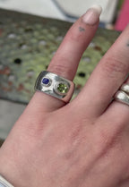 Handmade sterling silver cigar band with lapis carved face and peridot by em jono