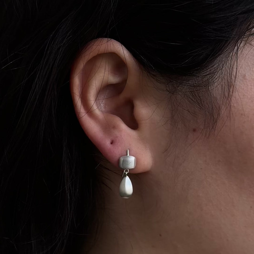 Handmade pair of sterling silver earrings with square and teardrop shapes by em jono 