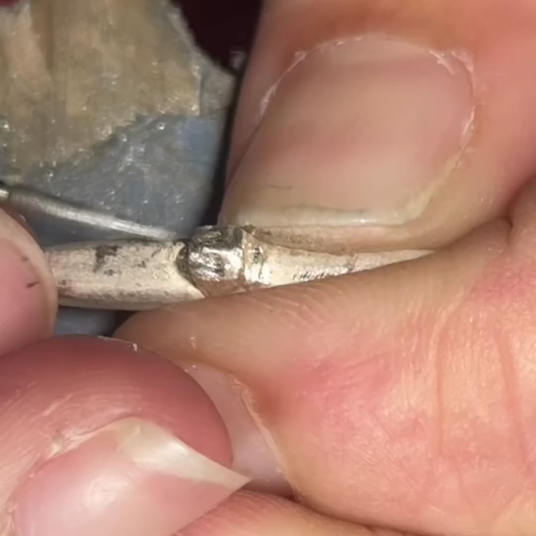 video carving a face in metal for an earring by em jono
