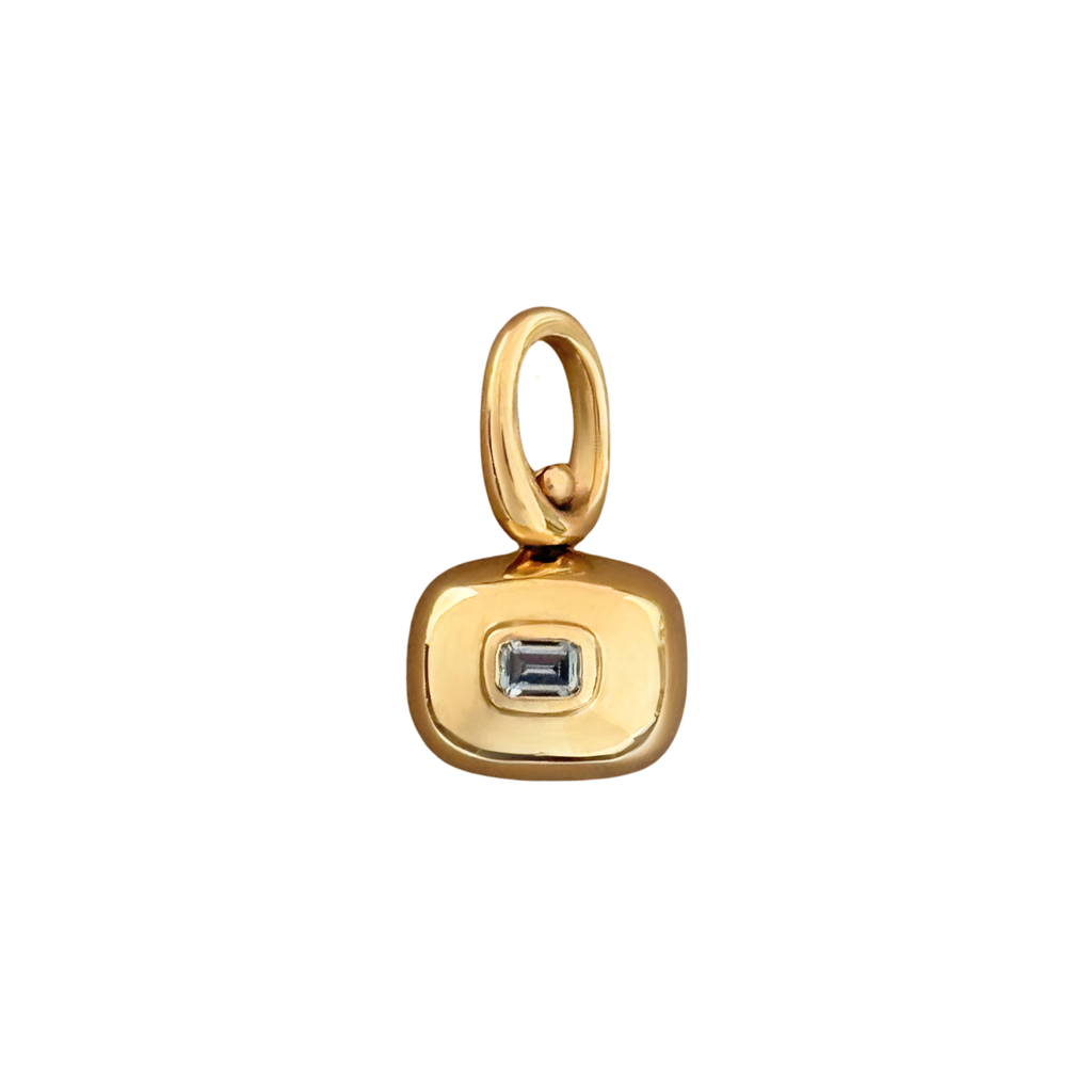 two sided 10k gold spinner pendant with a natural blue sapphire and handmade by em jono 
